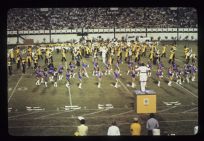 Marching band and cheerleaders performing